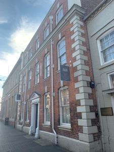a brick building with a sign on the side of it at Bridgnorth B&B in Bridgnorth