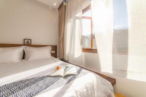 Postel nebo postele na pokoji v ubytování Dali Rong lu Hotel
