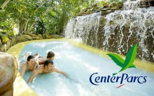 a group of men in a water slide at a waterfall at Gîte "Lovely Normandy" in Sainte-Marguerite-de-lʼAutel