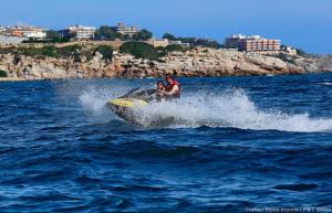 a man riding a jet ski in the water at Aries Basic in Salou
