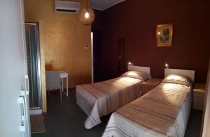A bed or beds in a room at Appartamento Piazza dei Popoli