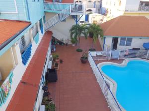 an aerial view of a hotel balcony with a swimming pool at Studio Pitaya in Les Trois-Îlets