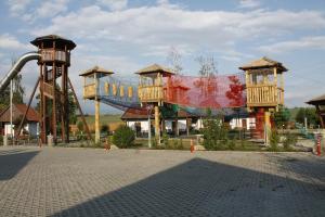 a ride in a park with a roller coaster at Slovácký dvůr s.r.o. in Ostrožská Nová Ves