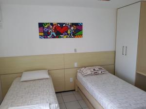 En eller flere senge i et værelse på Gran Lençóis Flat Residence 603 M