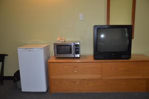 En tv och/eller ett underhållningssystem på Coachman Inn