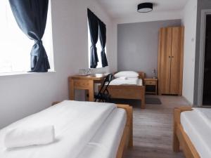 Ένα ή περισσότερα κρεβάτια σε δωμάτιο στο Bloom Inn