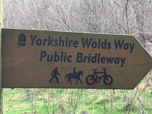 a sign that reads yorkshire wolds way public bridility at Nellies Shed, Wolds Way Holiday Cottages, 3 bed spacious cottage in Cottingham