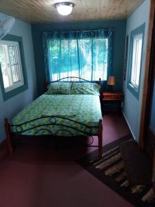 Llit o llits en una habitació de Casita Rio Indio