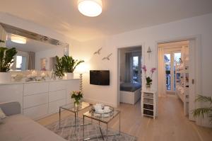 Televízia a/alebo spoločenská miestnosť v ubytovaní Luksusowy Apartament na Promenadzie