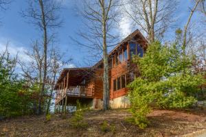 a log home in the woods at Kodiak #45 in Sevierville