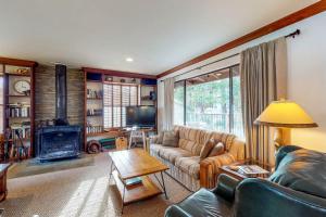 a living room with a couch and a fireplace at Heart's Desire on the Lake (01-275) in Groveland