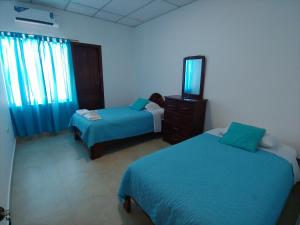 Voodi või voodid majutusasutuse Hostal Punta Arena toas