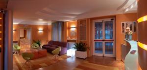 a living room with a couch and a table at AlbaResidence Masera26 in Alba