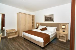 Postel nebo postele na pokoji v ubytování Hotel Le Balze - Aktiv & Wellness