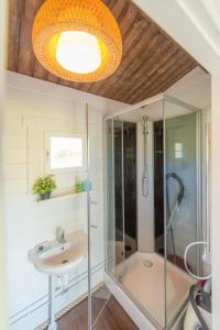 a bathroom with a shower and a sink at Cozy Summerhouse in Nasva in Nasva