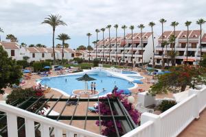 a view of the pool at a resort with palm trees at Parque Santiago 2 - Casa del Sol in Playa de las Americas