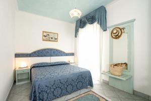Postel nebo postele na pokoji v ubytování Hotel Elpiro