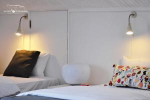 Uma cama ou camas num quarto em Alecrim Rosmaninho Guest House