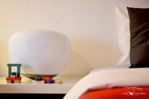 Uma cama ou camas num quarto em Alecrim Rosmaninho Guest House