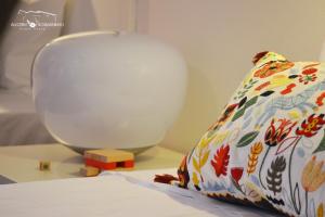 Uma cama ou camas num quarto em Alecrim Rosmaninho Guest House