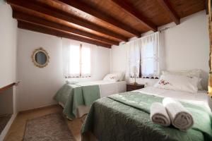 A bed or beds in a room at Secret Paradise Beach Villa
