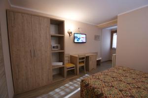 TV a/nebo společenská místnost v ubytování Hotel Europa