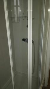 a shower with a glass door in a bathroom at Fantastic 1 Bedroom Apartment at Roma Avenue - 1B in Lisbon