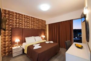 Postel nebo postele na pokoji v ubytování Hotel Kalithea