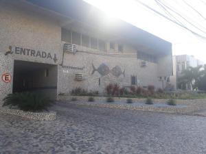 a building with the entrance to a building at Motel Devaneios (Adult Only) in Recife