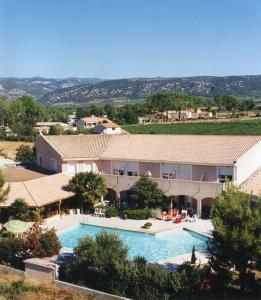 a view of a house with a swimming pool at Hostellerie Saint Benoît in Aniane