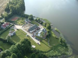an aerial view of a house on an island in the water at Siedlisko Agroturystyczne in Mrągowo