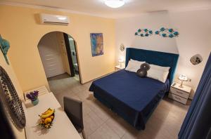 Postel nebo postele na pokoji v ubytování Hotel Kalithea