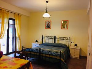 Postel nebo postele na pokoji v ubytování Il Poggio Dei Pettirossi