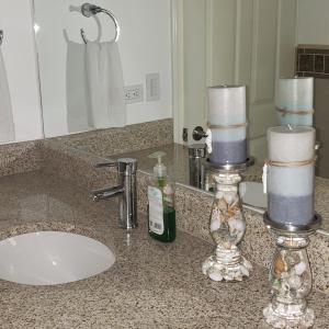 a bathroom counter with a sink and a mirror at Corona Del Sol 1104, Puerto Peñasco, Las Conchas in Puerto Peñasco