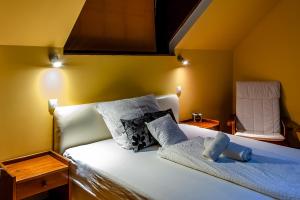 Voodi või voodid majutusasutuse Bástya Hotel toas