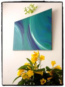 a painting of a vase of flowers on a wall at La Zagara Hotel in Canneto
