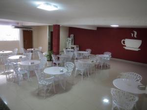 En restaurant eller et andet spisested på Pousada Golden House - Próxima ao Thermas no Centro de Aguas