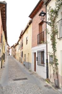 a street in an old town with a street light at CASA JOTA in Lerma