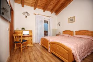 Postel nebo postele na pokoji v ubytování Hotel Garnì Villanova