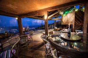 a restaurant with a view of the ocean at Villa Buena Vista in Praia do Rosa