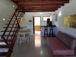 a living room with a couch and a table at WinterVille Gravatá - Flats in Gravatá