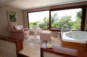 a large bathroom with a tub and a large window at Beyaz Ev Agva - Adult only +15 in Agva +152 photos