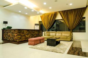 a living room with a couch and a table at Dreamwave Hotel Santiago in Santiago