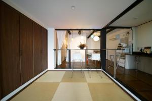a room with a kitchen and a living room at CHELSEA24 in Kyoto