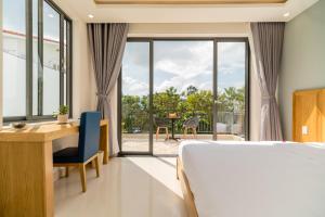 Postel nebo postele na pokoji v ubytování Babylon Hoi An Central Villa + 45 fotografií