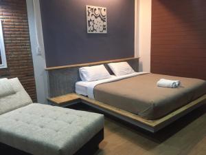 Postel nebo postele na pokoji v ubytování The C Hotel