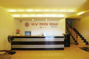 a lobby with a new puck india hotel sign on the wall at New Priok Indah Syariah Hotel in Jakarta