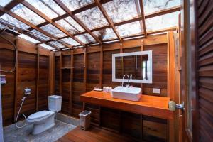 a bathroom with a sink and a toilet at Lipe Beach Resort in Ko Lipe