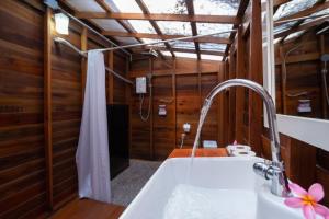 a bathroom with a sink and a shower at Lipe Beach Resort in Ko Lipe