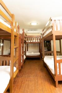 Postel nebo postele na pokoji v ubytování Past Tense Hostel